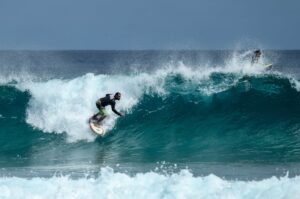 photo of man surfing